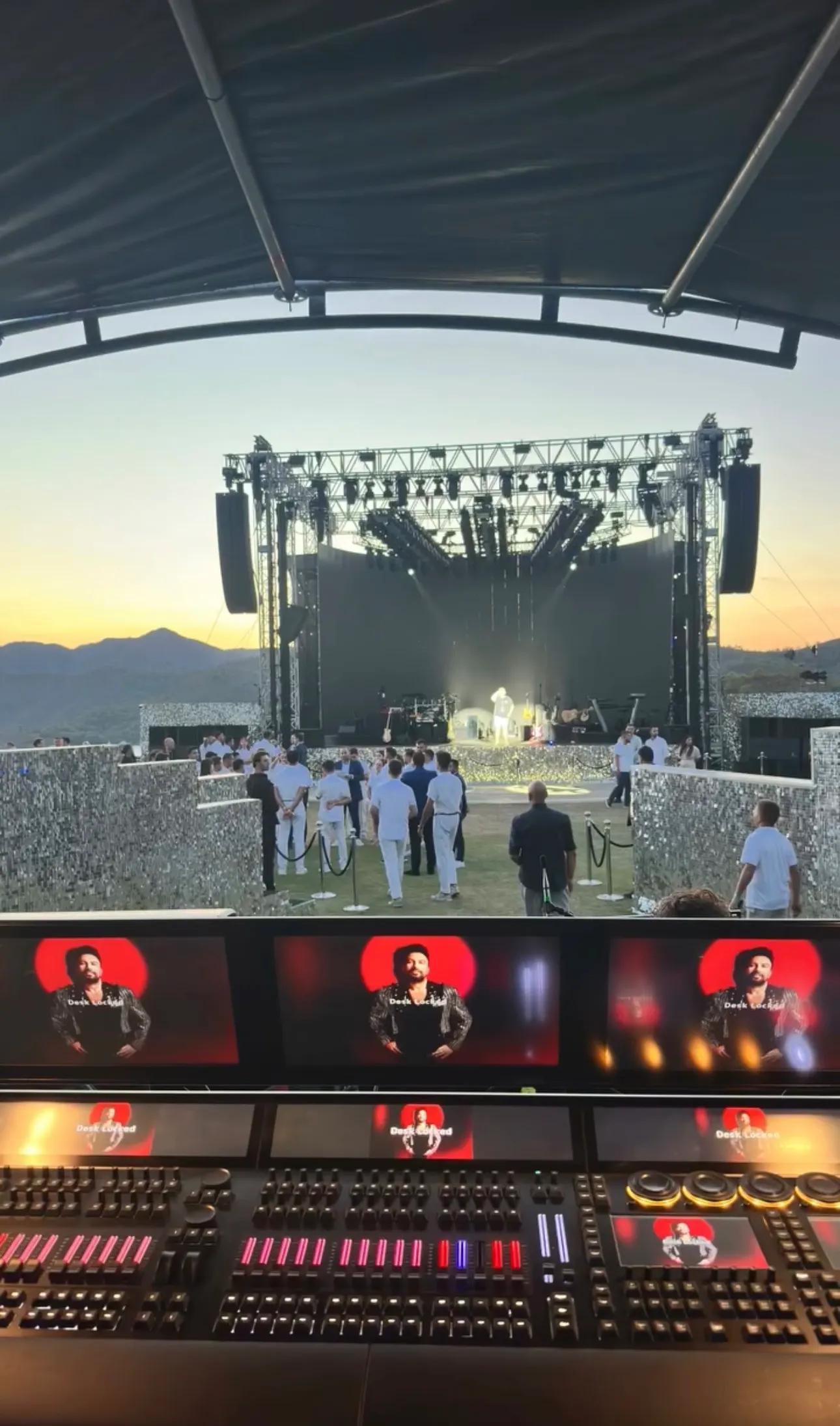 An open-air concert stage at sunset